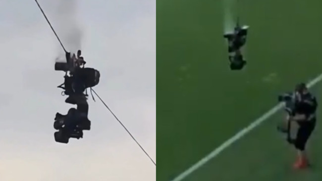 Uma câmera despenca no chão no meio de uma partida de futebol, escapando por pouco do desastre
